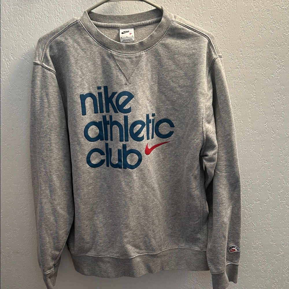 33. Nike Men's Gray Crewneck Sweatshirt-minor flaw on sleeve as shown
